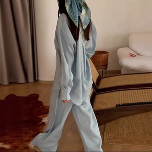 Women's casual light blue two-piece set featuring loose long sleeve shirt and trousers