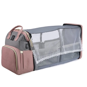 Pink and grey multi-functional diaper bag that unfolds into a portable baby bed with net