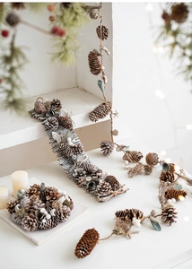 Close-up of rustic Christmas wreath with natural pine cones and dried wooden branch details