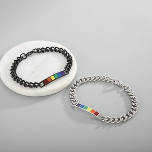 Close-up of black and silver rainbow enamel bar bracelets with stylish cuban links