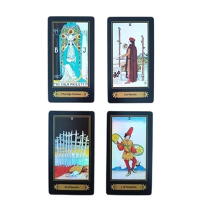 Macro detail of tarot cards featuring The High Priestess and traditional golden illustrations