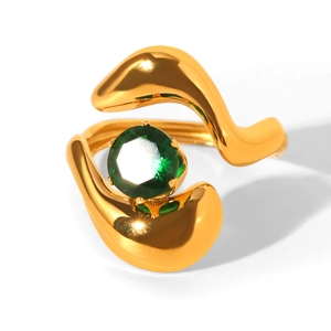 Detail shot of a polished gold-plated ring featuring a vibrant green round-cut zircon stone