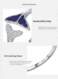 Macro detail of S925 sterling silver mermaid tail ring with blue and white zircons