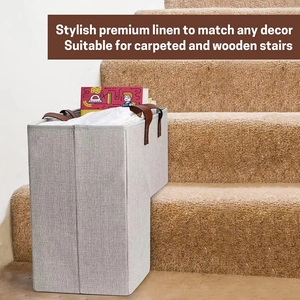 Close-up of gray linen staircase basket with leather handles on carpeted stairs