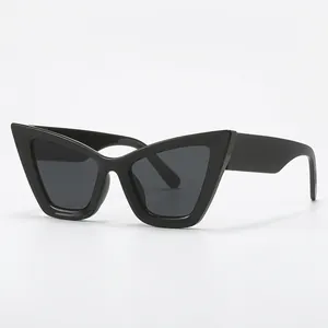 Classic black cat eye sunglasses with dark grey lenses and retro pointed frame style