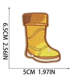 Detailed view showing dimensions of yellow embroidered boot patch on a white background