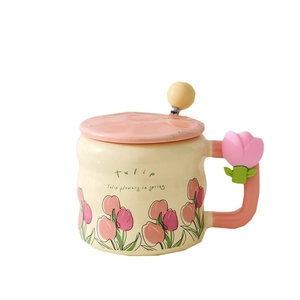 Ceramic tulip coffee mug set with lid and spherical spoon on a white background