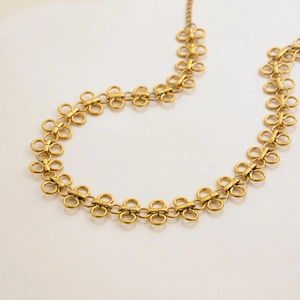 Elegant gold titanium steel clover necklace with minimalist infinity link chain design