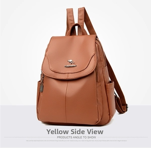 Close-up of brown litchi pattern leather texture and golden kangaroo logo on the backpack