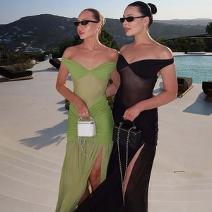Detail of off-shoulder mesh patchwork slit dress in green and black for summer vacations