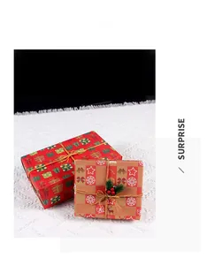 Detail of Christmas gift boxes with snowflake patterns, jute twine and pine needle accents