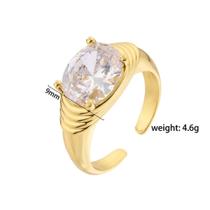 Close-up of gold 9mm oval cubic zirconia ring with wave textured adjustable band