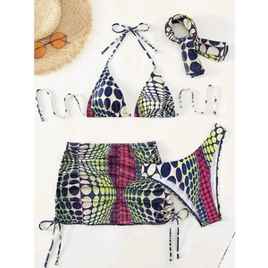 Flat lay of a 4-piece bikini set with printed skirt and matching headband for vacations