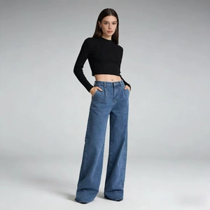 Detailed texture of high-waist wide-leg blue jeans and slim-fit black ribbed knit top