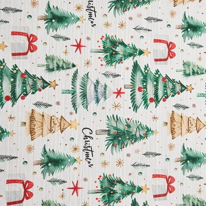 Detail of Christmas theme pattern on textured fabric with trees and gift boxes