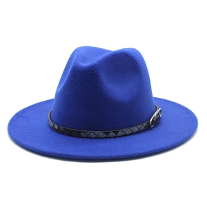 Close-up of royal blue fedora hat with black woven leather band and metal buckle detail