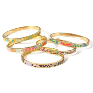 Set of stacked 18K gold plated stainless steel bangles with colorful enamel patterns
