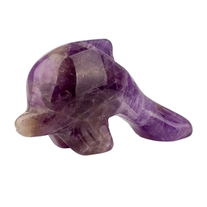 Natural amethyst crystal dolphin carving with translucent purple textures on white background