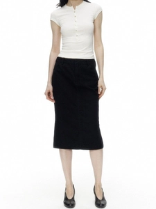Slim fit white Henley shirt with shell buttons paired with a black midi skirt