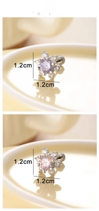 Detail view of 1.2cm floral stud earrings with pink and purple heart-shaped zircons