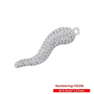 Detailed view of a silver cornicello pendant with pave-set zircons measuring 31x8.5mm