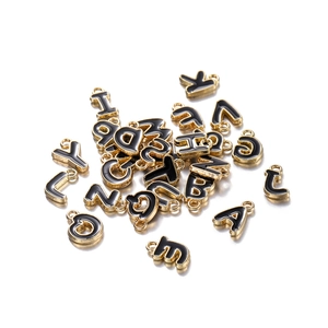 Bulk gold plated alphabet charms with black enamel finish for DIY jewelry crafting
