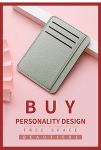 Detail of slim litchi texture PU leather card holder with three vertical slots in sage green