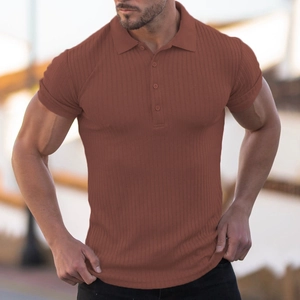 Detail of tan slim fit ribbed polo shirt showing the textured knit and button placket
