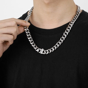 Men's 13mm silver curb chain necklace with a box clasp, styled on a black t-shirt