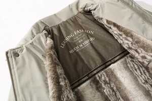 Detail view of winter coat with plush faux fur lining and leading fashion back print
