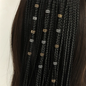 Boho spiral hair rings in gold and silver finish on braided hair with geometric patterns