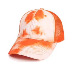 Detailed view of tie-dye orange mesh baseball cap with breathable fabric and curved brim