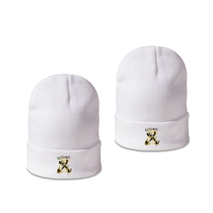 Stylish white knitted beanie with black and yellow graffiti print and NOTHING text