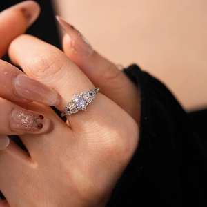 Close-up of a silver zircon crown wheat ear ring featuring intricate cutout details