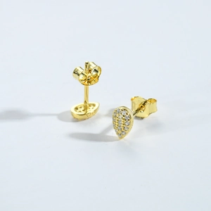 Detail shot of pear-shaped gold-plated S925 earrings with sparkling zircon micro-pave