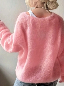 Close-up of soft pink mohair sweater showing premium fuzzy knit texture and loose fit back