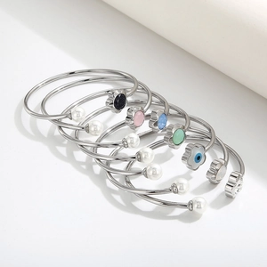Adjustable silver flower bangle set with white pearls and colorful enamel charms