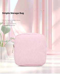 Detail of light pink corduroy storage bag with zipper and vertical stripe texture