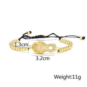 Close-up of gold leopard head bracelet with cubic zirconia details and size dimensions