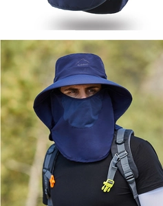 Detail of dark blue outdoor sun hat featuring breathable mesh face mask and embroidered sport logo