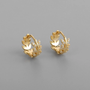 Close-up of S925 silver gold leaf earrings with white zircon inlay details