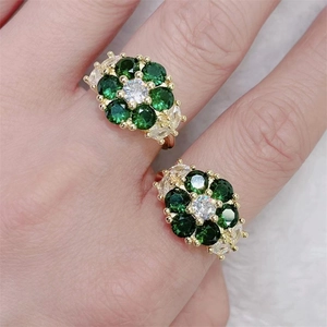 Adjustable copper ring set with green zircon flower petals and white pear-cut stones