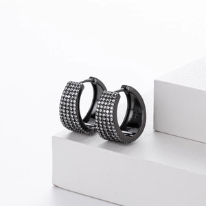 Detailed macro view of black s925 silver hoop earrings with micro-pave cubic zirconia