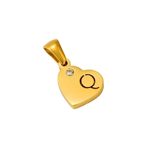 Macro detail of a gold heart pendant with crystal inlay and engraved letter Q charm