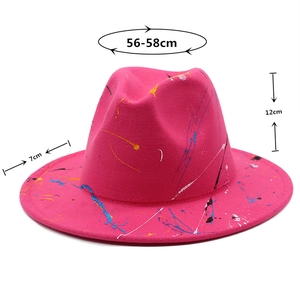 Pink graffiti fedora hat featuring artistic paint splatter and size chart detail