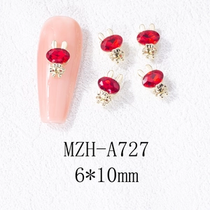 Détail de bijoux d'ongles lapin doré de 6x10mm avec cristaux rouges pour manucure