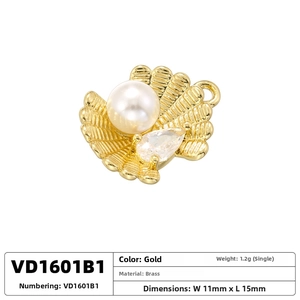 Detailed view of 11x15mm gold-plated brass shell pendant with pearl and cubic zirconia