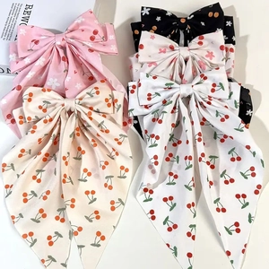 Chiffon bow hair clips featuring cherry and floral prints in pink, beige, and black colors