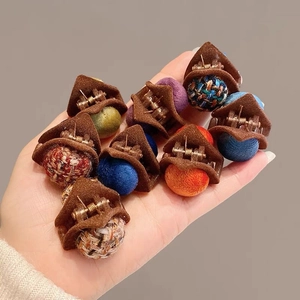 Colorful plush cat ear hair claws in various vibrant shades and knit textures