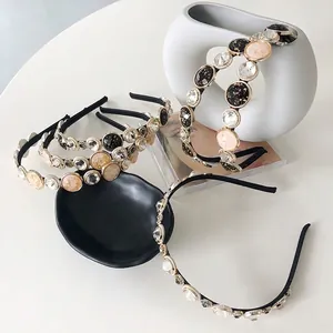 Baroque style thin headband with black resins and sparkling rhinestones on white base